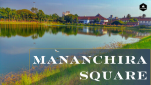 Mananchira Square in Kozhikode featuring its iconic pond, surrounded by lush greenery, well-maintained pathways, and a tranquil atmosphere.