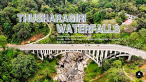 A breathtaking view of Thusharagiri Waterfalls cascading down lush green cliffs, surrounded by dense forest and mist, creating a serene and magical atmosphere.